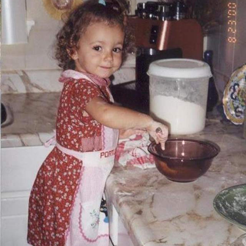 Sofia making pizza